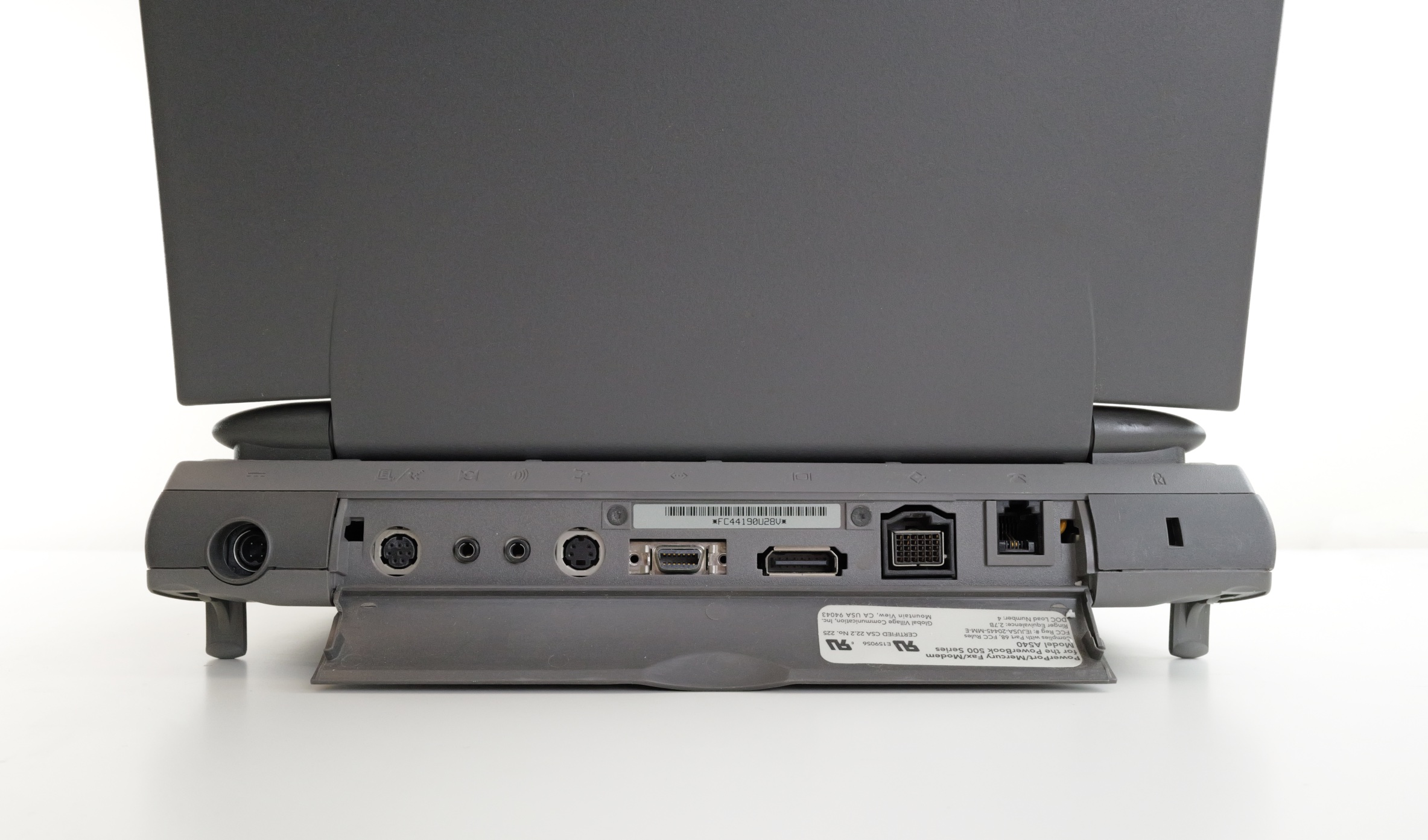 Macintosh PowerBook 540c rear detail; showing ports from left to right: power, serial (printer/modem), audio in, audio out, ADB, AAUI Ethernet, PowerBook video out, HDI-30 SCSI, phone jack for modem